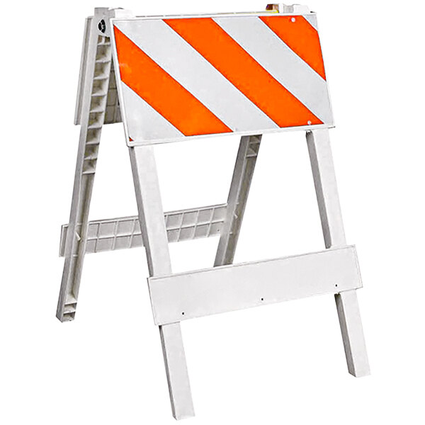 A white and orange Cortina Plastx safety barrier with white and orange stripes.