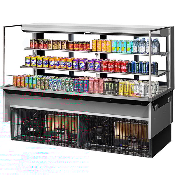 A Turbo Air drop-in refrigerated display case filled with cans of soda.