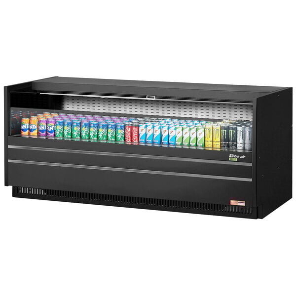 A black Turbo Air drop-in refrigerated display case with several cans of soda inside.