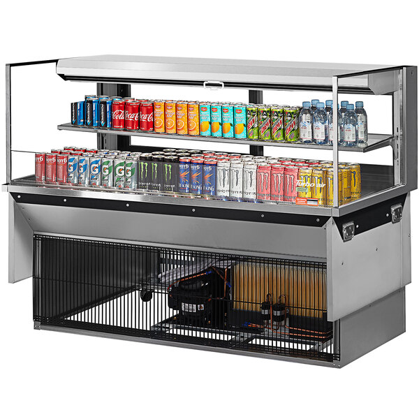 A Turbo Air drop-in refrigerated display case with drinks and cans on a shelf.