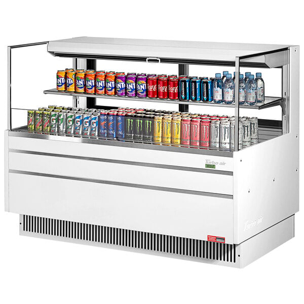 A white Turbo Air horizontal refrigerated curtain merchandiser with drinks on shelves.