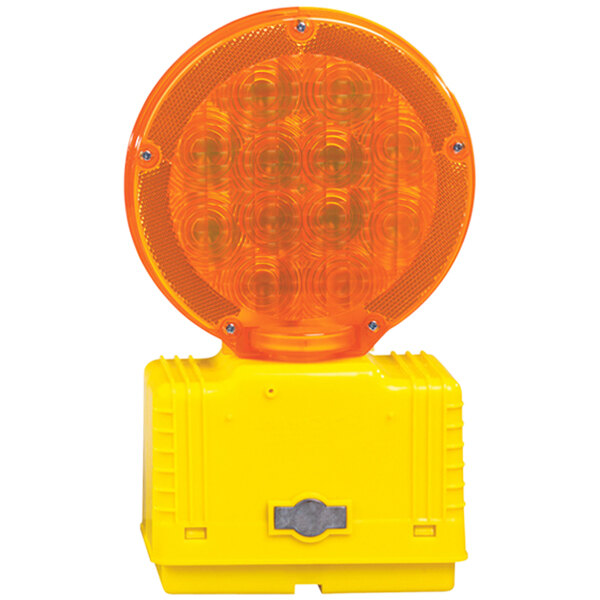 A Cortina Incandescent amber barricade light on a stand with a yellow round light.