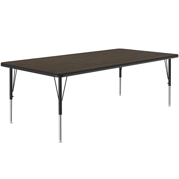 A rectangular Correll activity table with metal legs and a walnut top.