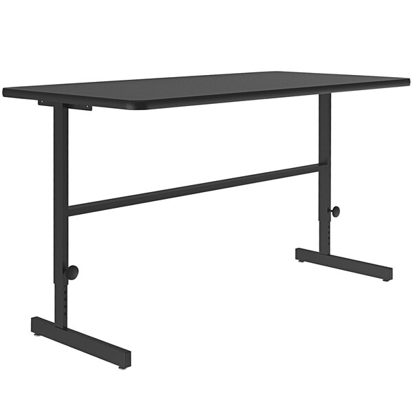 A black rectangular Correll standing height work station table with a black metal frame.