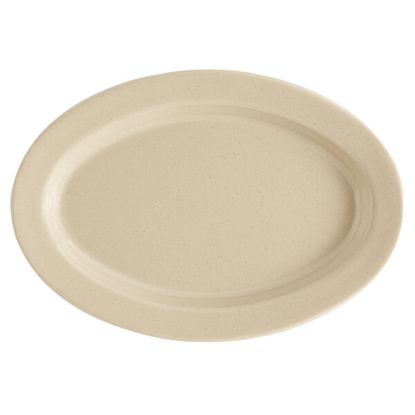 A white oval platter with a speckled sandstone surface.