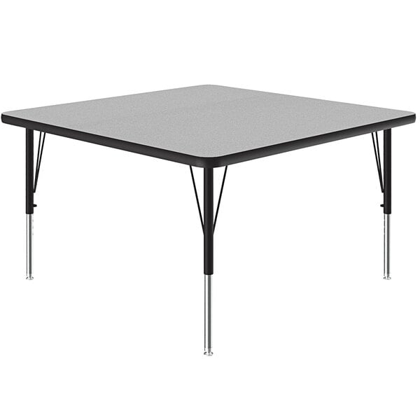 A square table with black legs and a gray granite top.