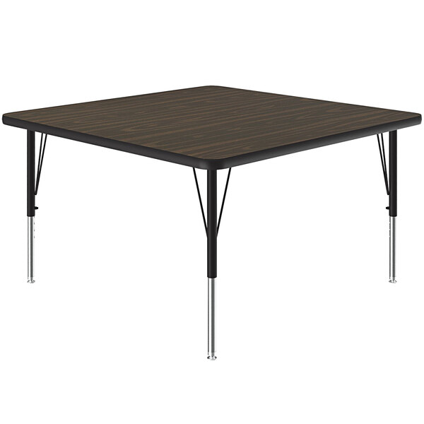 A square Correll activity table with metal legs and a walnut top.