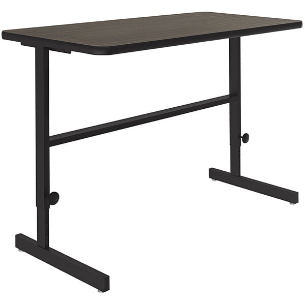 A walnut rectangular table with a black metal frame.