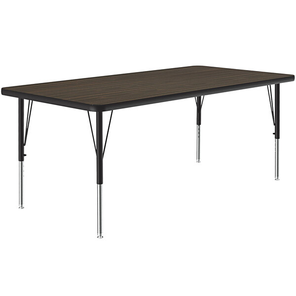 A rectangular Correll activity table with metal legs and a walnut top.