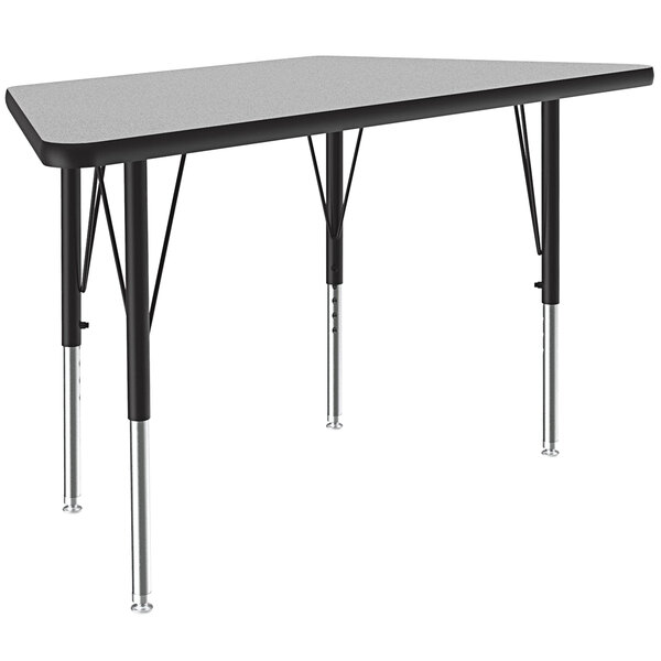 A grey and black rectangular Correll activity table with an adjustable height trapezoid grey granite top.