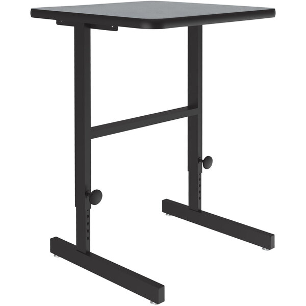 A black Correll adjustable standing height work station with a gray granite top.