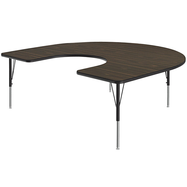 A Correll walnut horseshoe-shaped activity table with a black base.