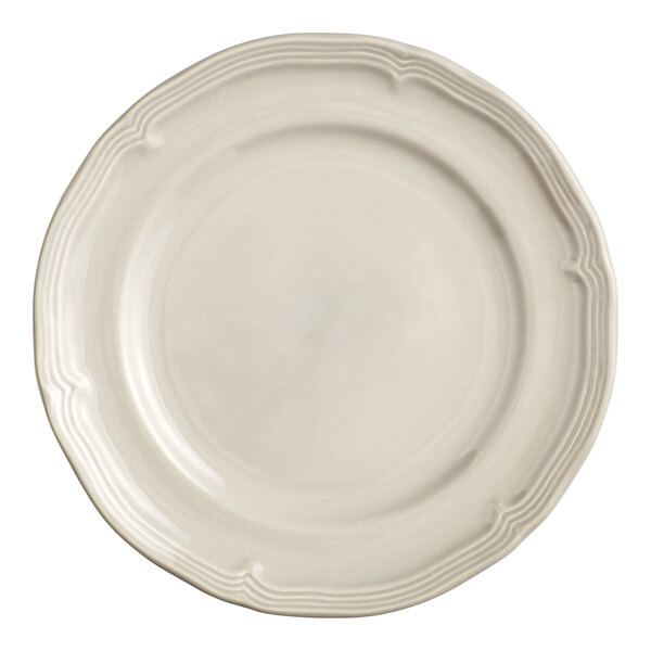 An Acopa Condesa warm gray porcelain plate with a scalloped wide rim.