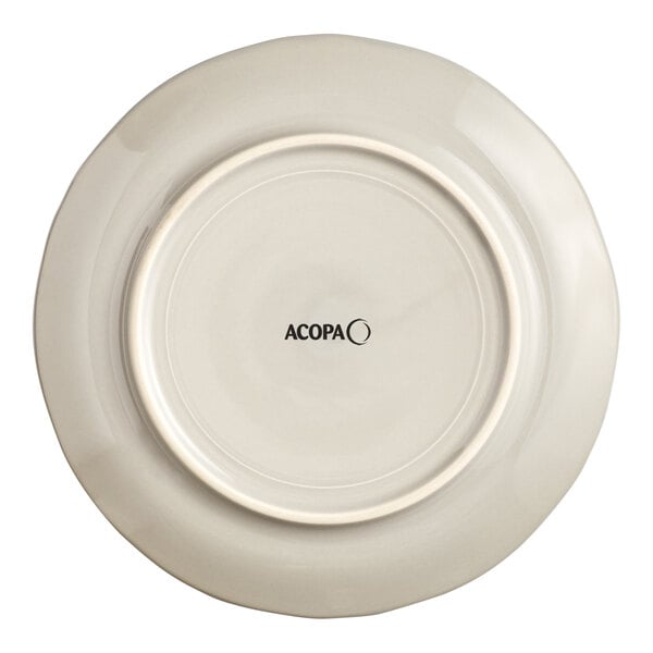 An Acopa Condesa warm gray porcelain plate with a scalloped wide rim.
