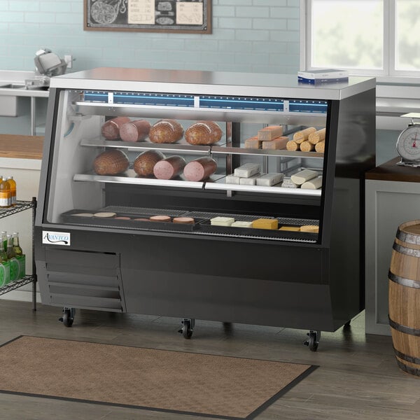 An Avantco black square glass refrigerated double-duty deli case on a counter with meats and cheese inside.