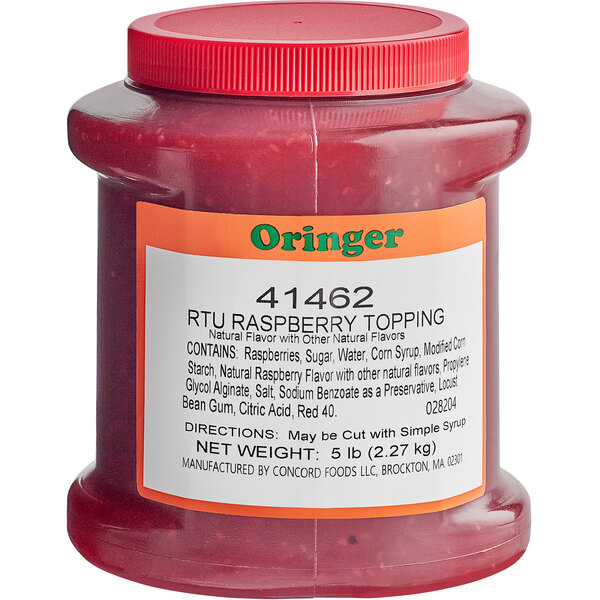 A container of Oringer raspberry dessert topping on a counter.