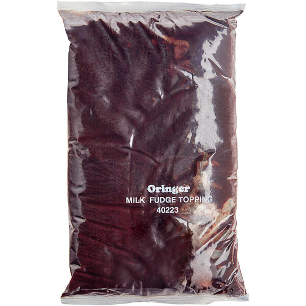 A white plastic bag of Oringer Milk Fudge Dessert Topping.