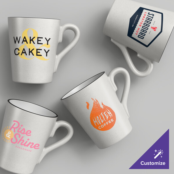 A set of four gray matte stoneware mugs with different custom printed designs.