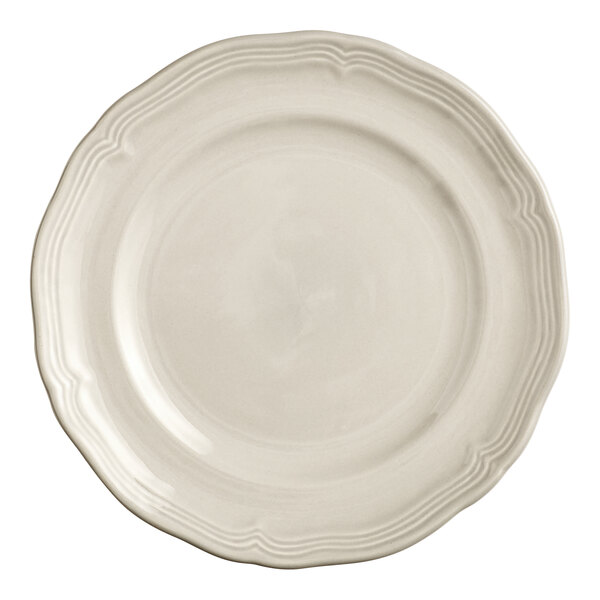 A white Acopa Condesa porcelain plate with a scalloped wide rim.