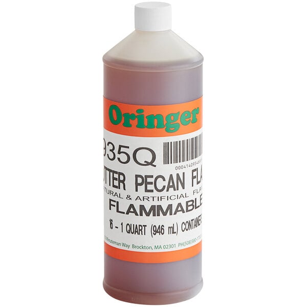 A bottle of Oringer Butter Pecan hard serve ice cream flavoring on a counter with an orange label.
