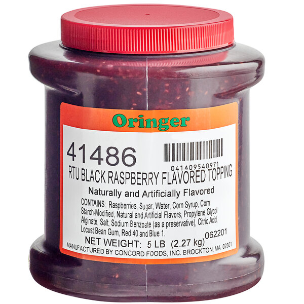 A case of Oringer Seeded Black Raspberry syrup on a counter.