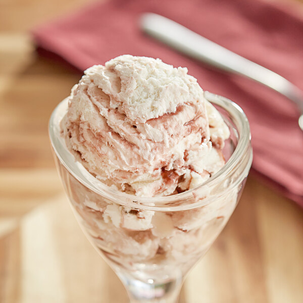 A glass cup with a scoop of Oringer Black Raspberry Variegate.