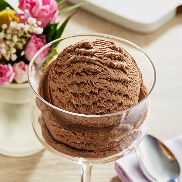 A scoop of Oringer Maple Hard Serve Ice Cream in a glass bowl.