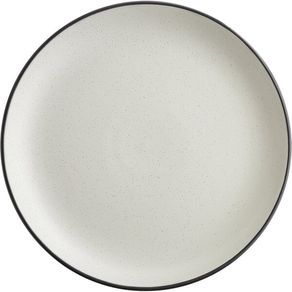 An Acopa Embers stoneware coupe plate with a matte grey finish and black rim.