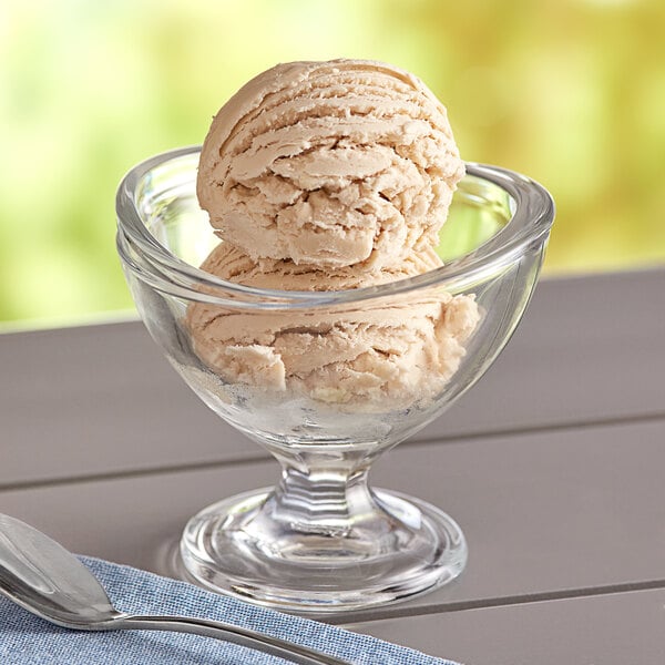 A bowl of Oringer Bavarian hard serve ice cream with a spoon.