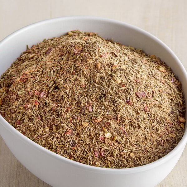 A bowl of McCormick Culinary Caribbean Jerk Seasoning on a table.