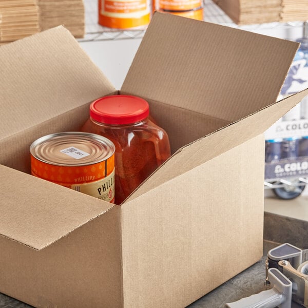 A Lavex corrugated shipping box containing a container and can of food.