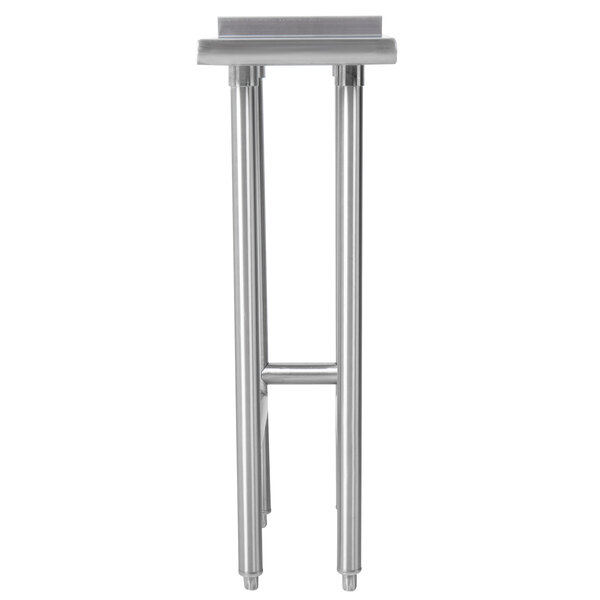 An Advance Tabco stainless steel filler table with metal legs.