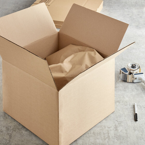 A Lavex corrugated cardboard shipping box with crumpled paper inside.