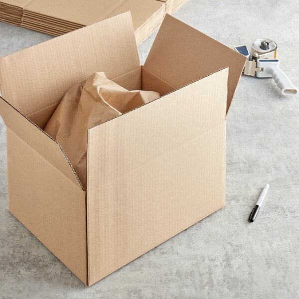 A Lavex cardboard shipping box with a bag inside.