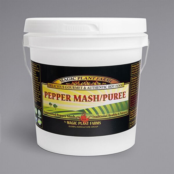 A white bucket of Fiery Farms Smoked Red Carolina Reaper Pepper Mash with a label.