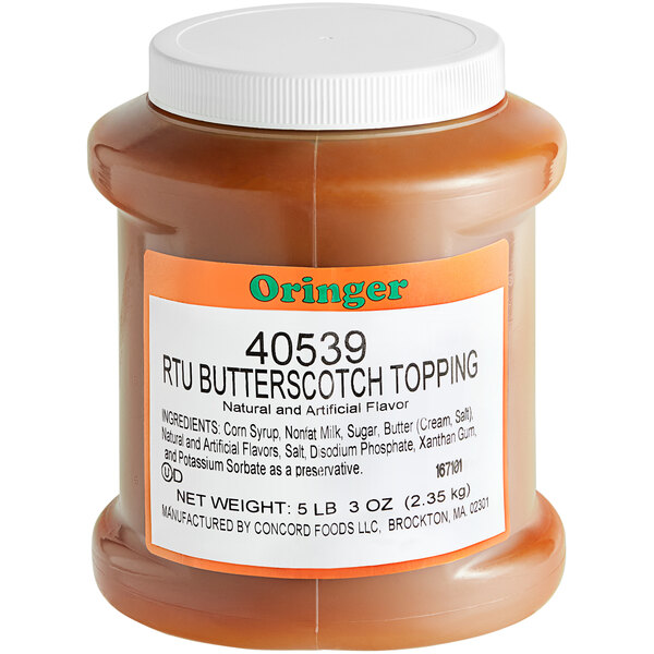 A jar of Oringer Butterscotch Dessert Topping on a counter.