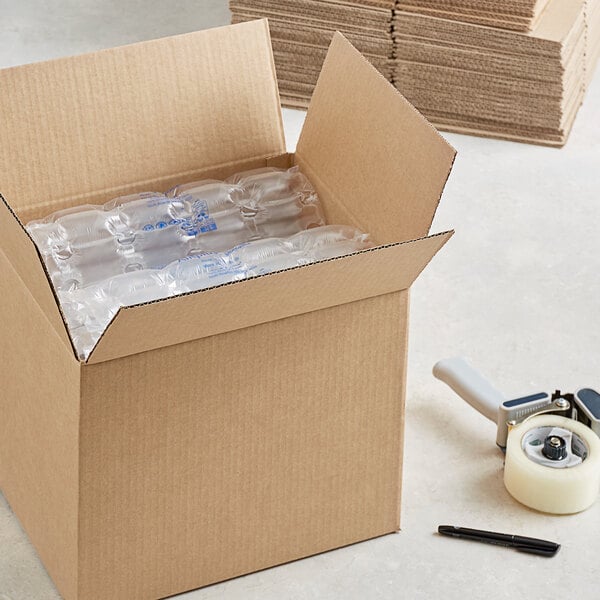 A Lavex corrugated cardboard shipping box with clear plastic bottles inside.