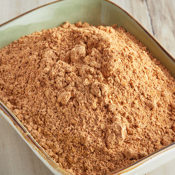 A white bowl of McCormick Culinary Taco Seasoning powder.