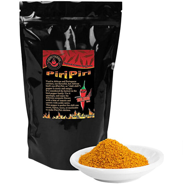 A black bag of Fiery Farms Red African Bird's Eye Pepper Powder with a bowl of yellow powder.