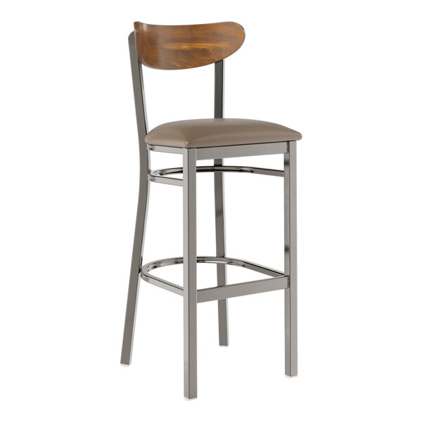 A Lancaster Table & Seating bar stool with taupe vinyl and wood back on a metal frame.