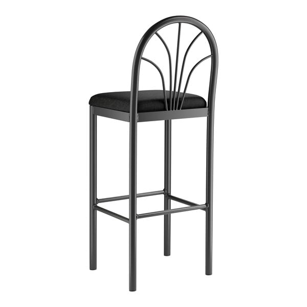 A Lancaster Table & Seating Spoke Back Bar Stool with a black fabric seat on a metal frame.
