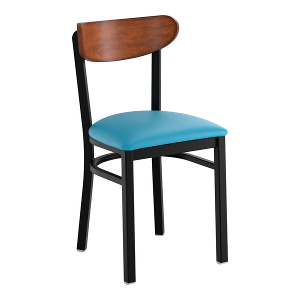 A black metal chair with a blue vinyl seat and an antique walnut wood backrest.