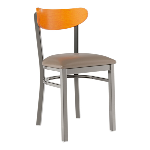 A Lancaster Table & Seating Boomerang chair with a brown cushioned seat and cherry wood back.