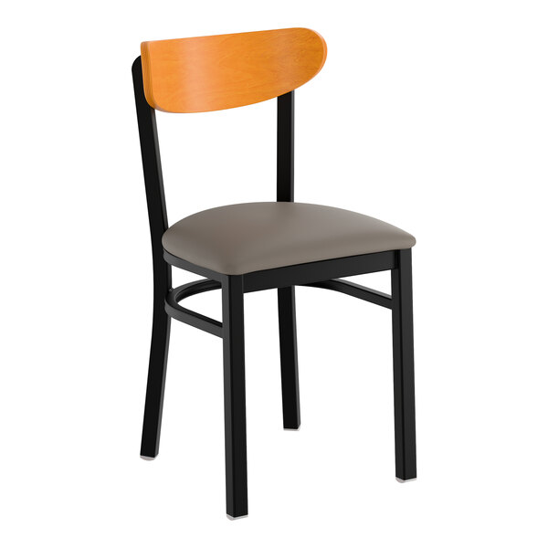 A black metal chair with a dark gray vinyl seat and a cherry wood backrest.