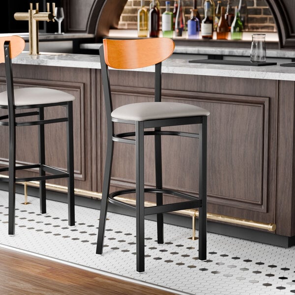 Lancaster Table & Seating Boomerang Black Finish Bar Stool with Light Gray Vinyl Seat and Cherry Wood Back