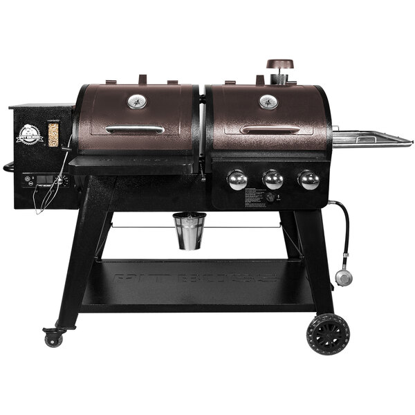 A black and brown Pit Boss Mahogany Series gas and pellet combo grill on wheels with a lid.