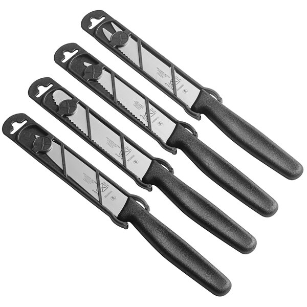 A group of four Mercer Culinary paring knives with black handles.