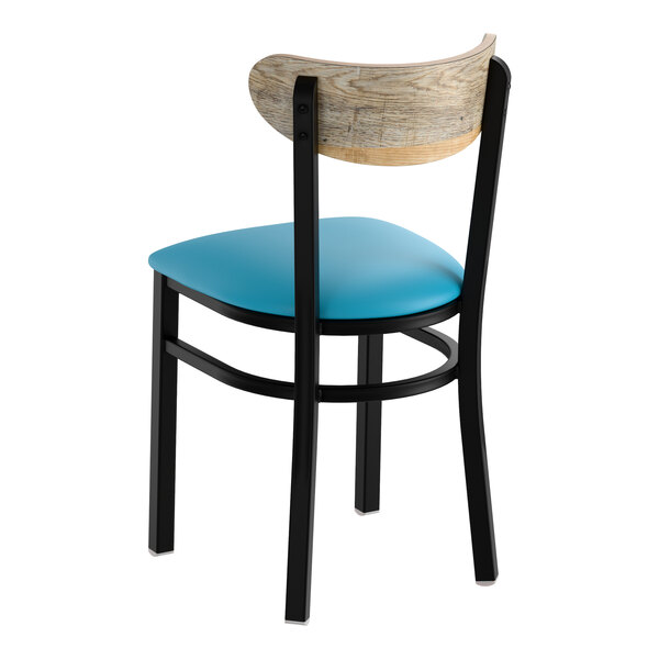A black metal chair with a blue vinyl seat and a driftwood-finished curved wooden backrest.