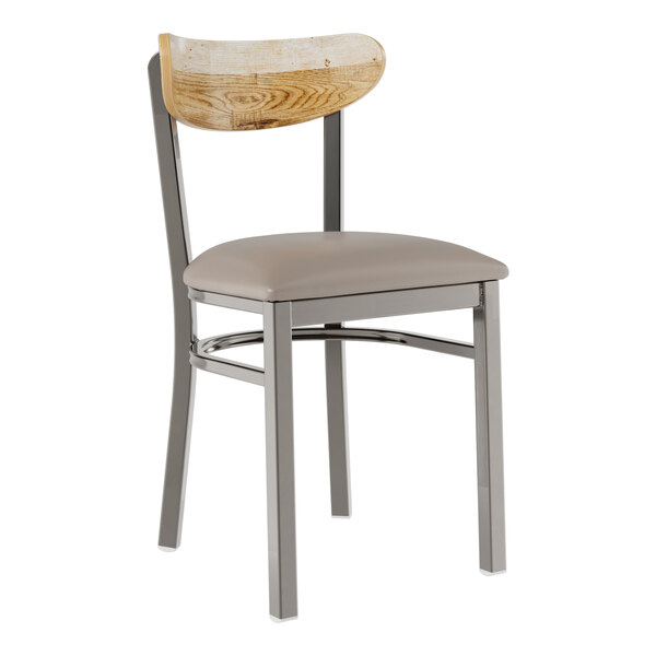A Lancaster Table & Seating Boomerang chair with a dark gray cushion and driftwood back.