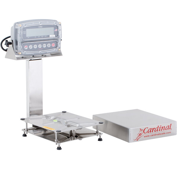 A Cardinal Detecto electronic bench scale with a box on it and a tower display.